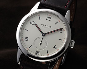 mX(NOMOS)